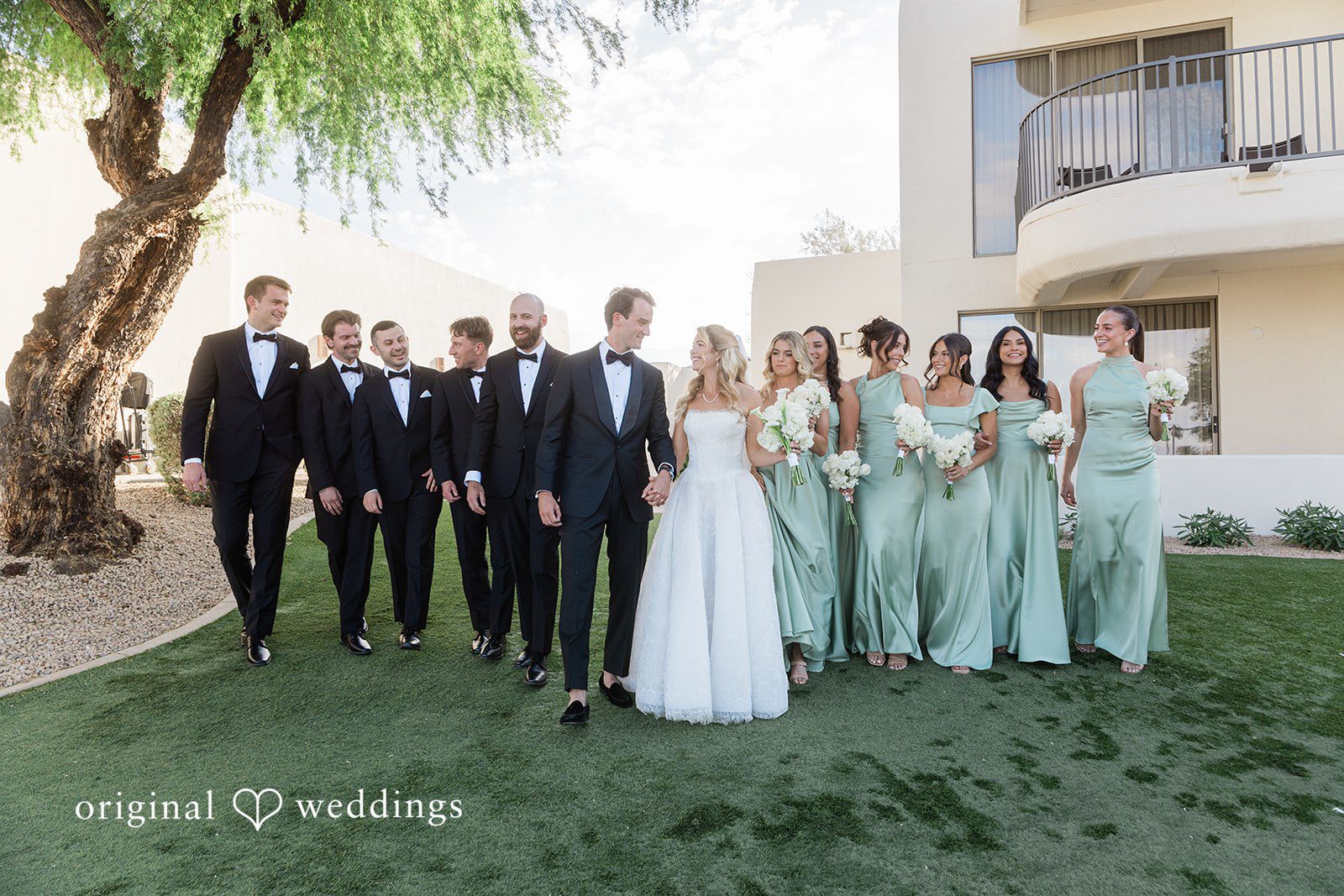 Kathryn + Calum Wedding party group photo celebrating together outdoors