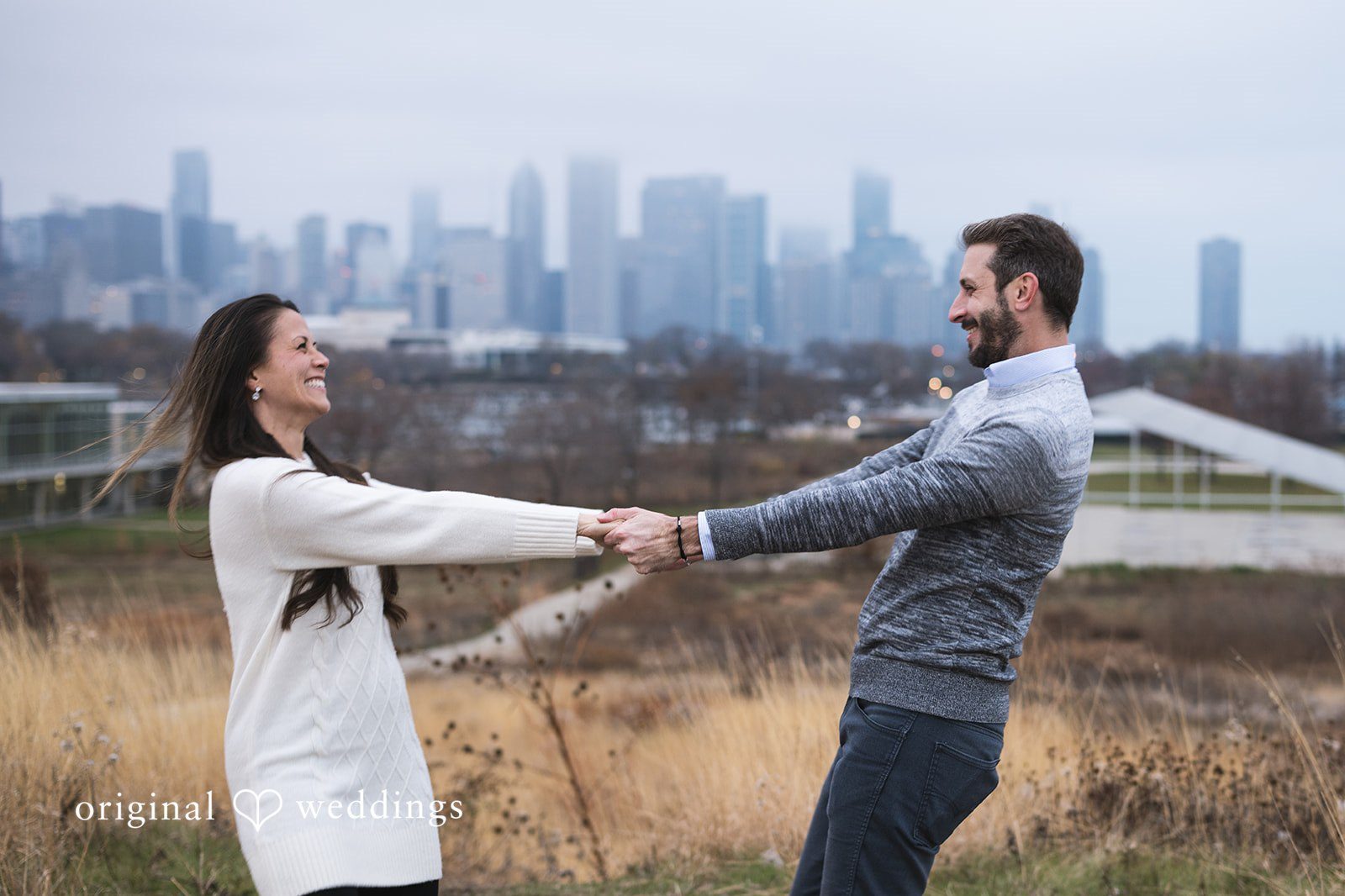 Chicago engagement photographers capturing couple portraits at Adler Planetarium with skyline views