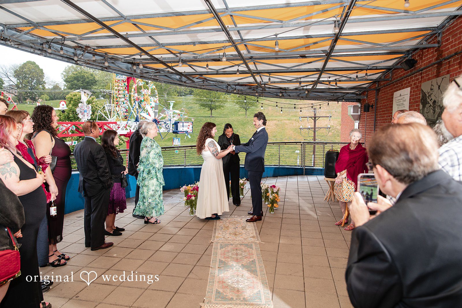 Leah + Daniel Bride and groom listening during the wedding ceremony vows