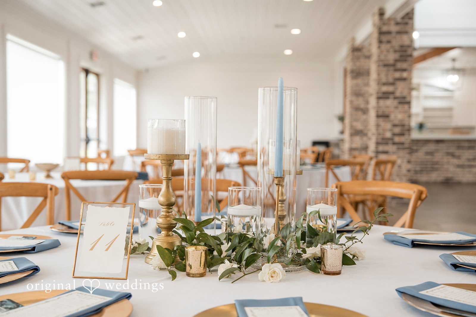 Kennedy + Collin Beautifully decorated tables at the wedding reception hall