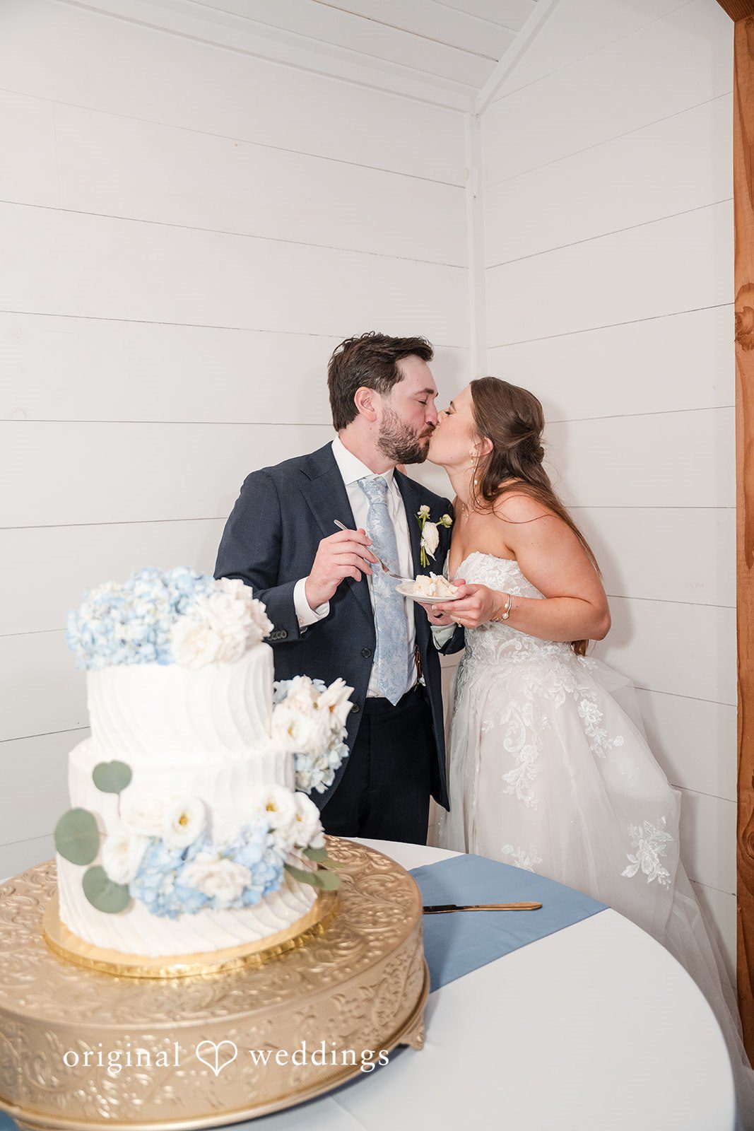 Kennedy + Collin The couple shares a romantic kiss while feeding each other
