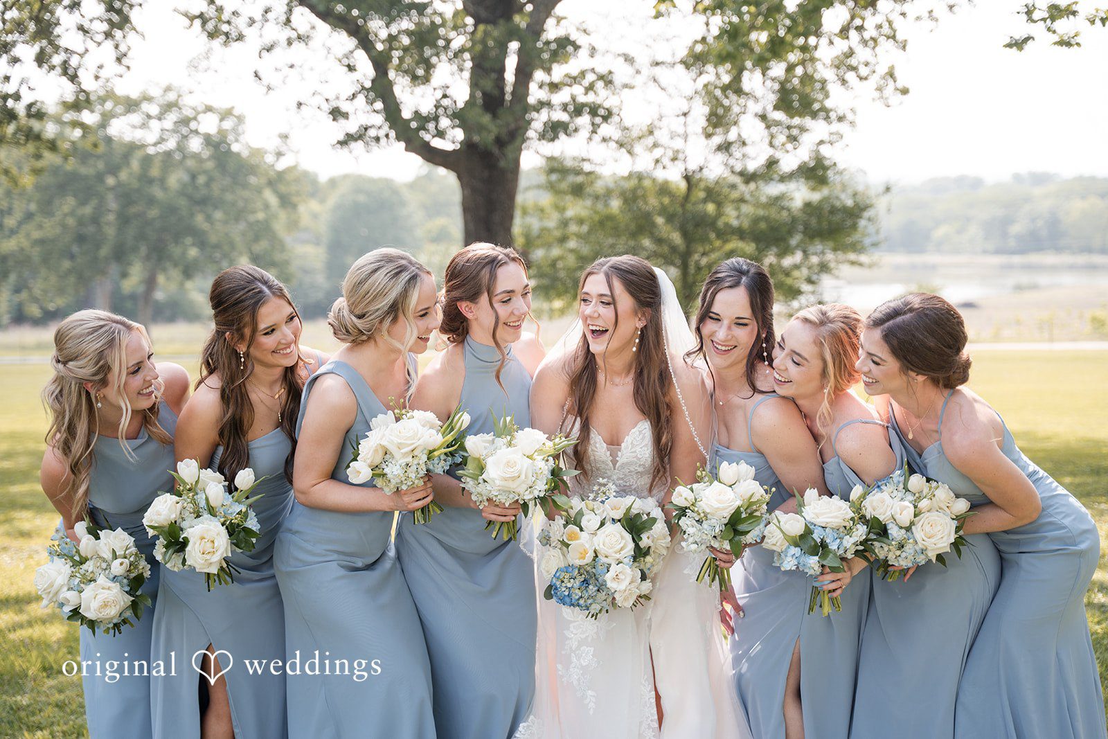 Kennedy + Collin A happy portrait of the bride and her bridesmaids