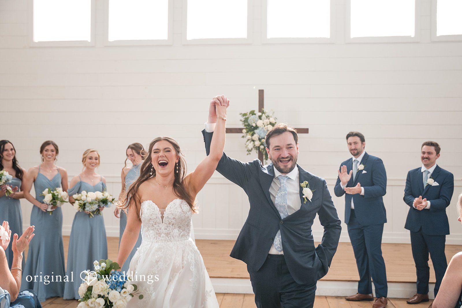 Kennedy + Collin Our Houston wedding photographers at Original Weddings captured a joyful portrait of the couple after their wedding ceremony