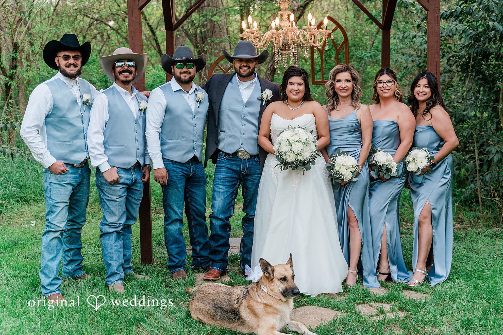 Our Dallas wedding photographers at Original Weddings captured a stunning portrait of the couple and their bridal party at the Arrowwood Events outdoor space