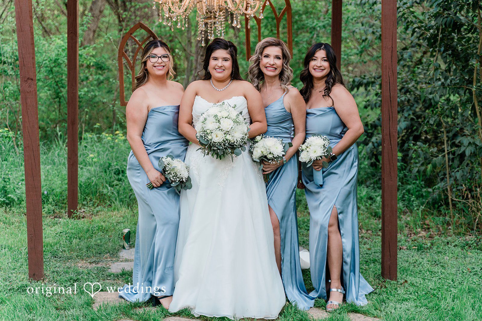 A portrait of the bride with her bridesmaids