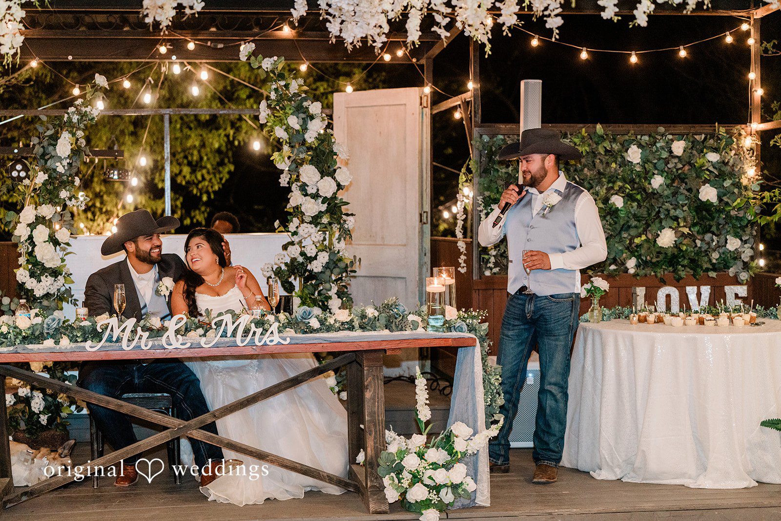 One of the groomsmen makes a speech at the wedding reception
