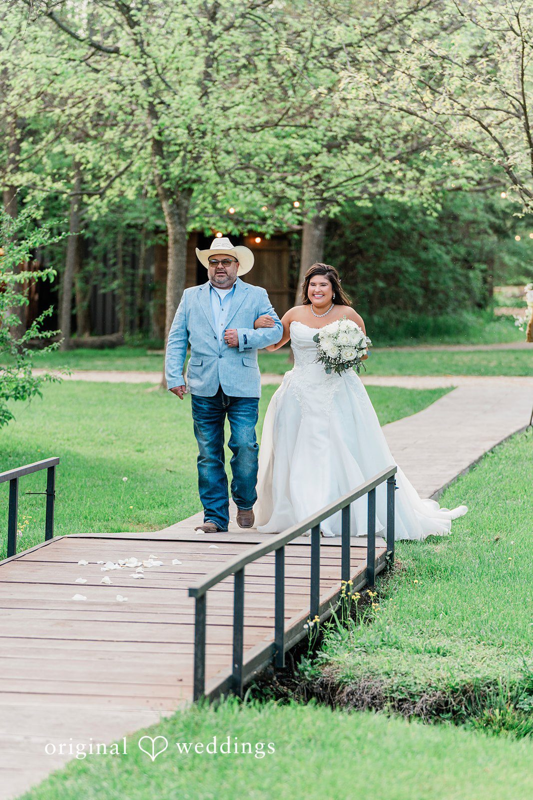 The bride's father walks bride down the aisle