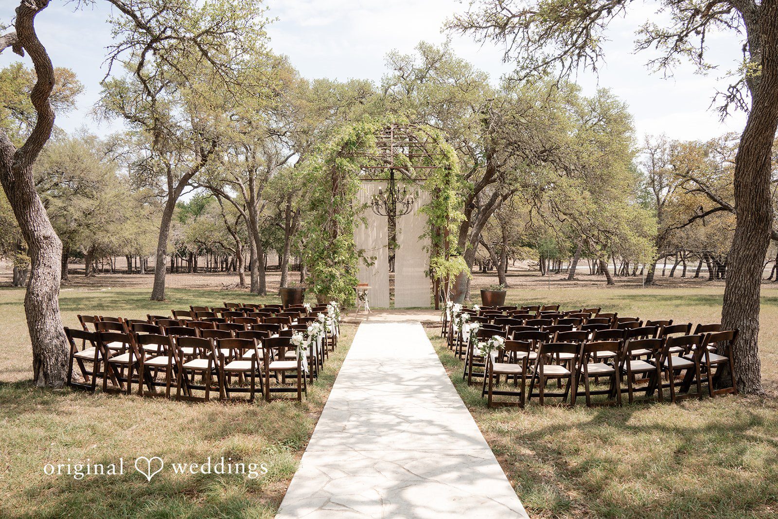 Hannah + Will Outdoor ceremony setup at Asante Lodging Wedding venue