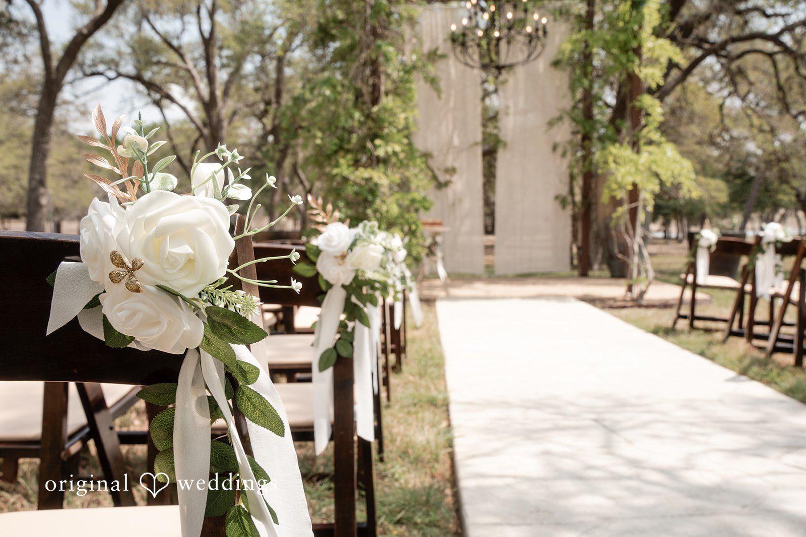 Hannah + Will Floral ceremony decor detail at Asante Lodging