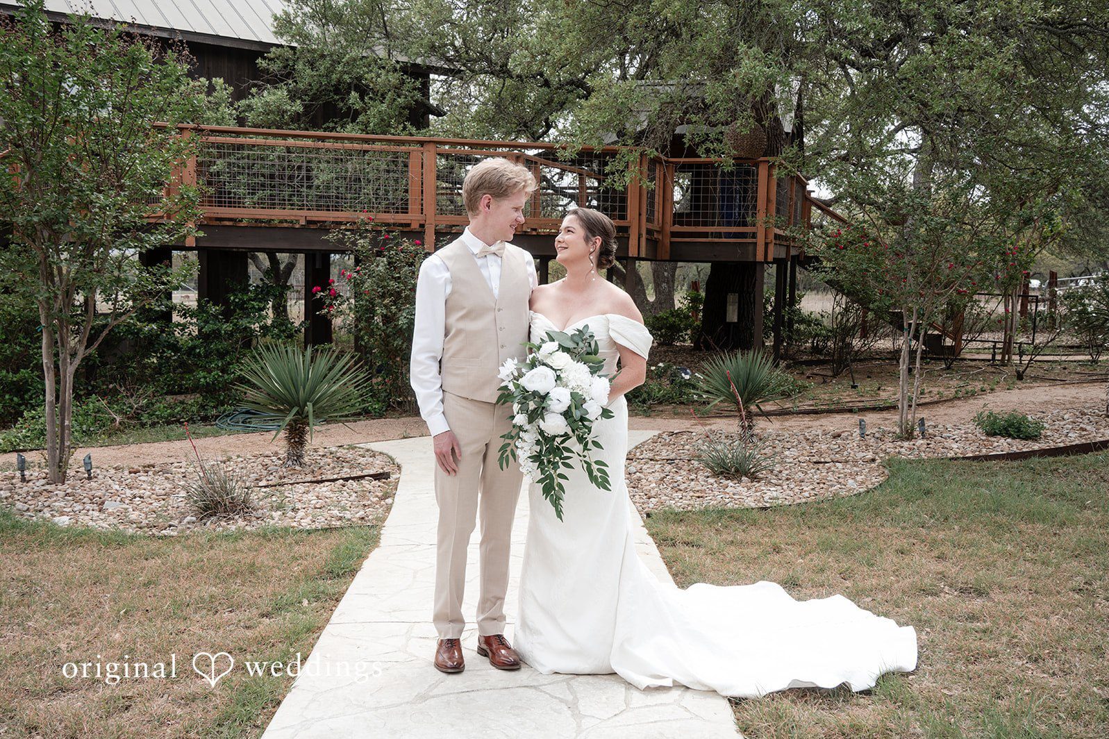 Austin Wedding Photographers capturing Hannah & Will’s romantic outdoor couple portrait at Asante Lodging Wedding venue, Original Weddings