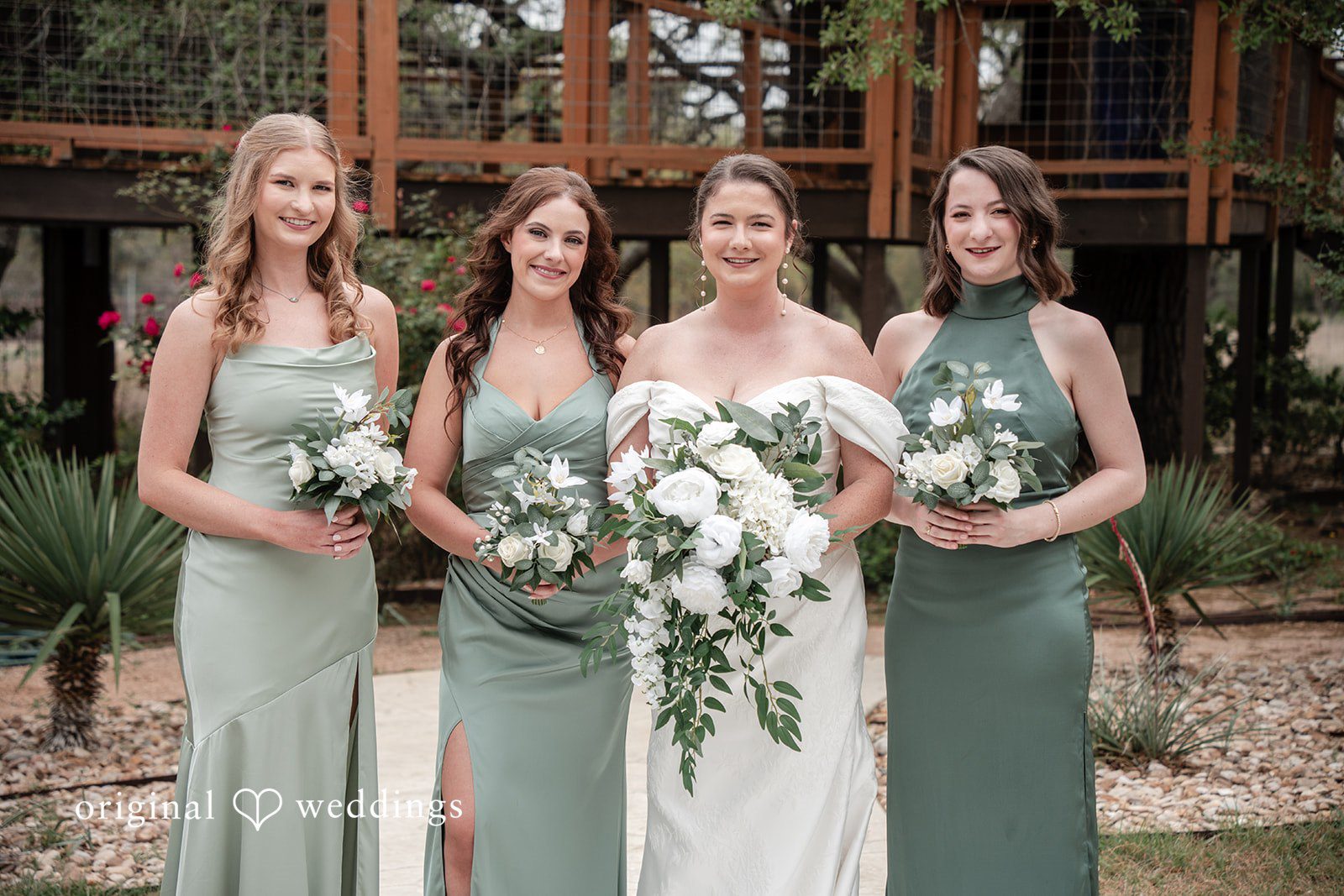 Hannah + Will Bride with bridesmaids in a joyful group portrait