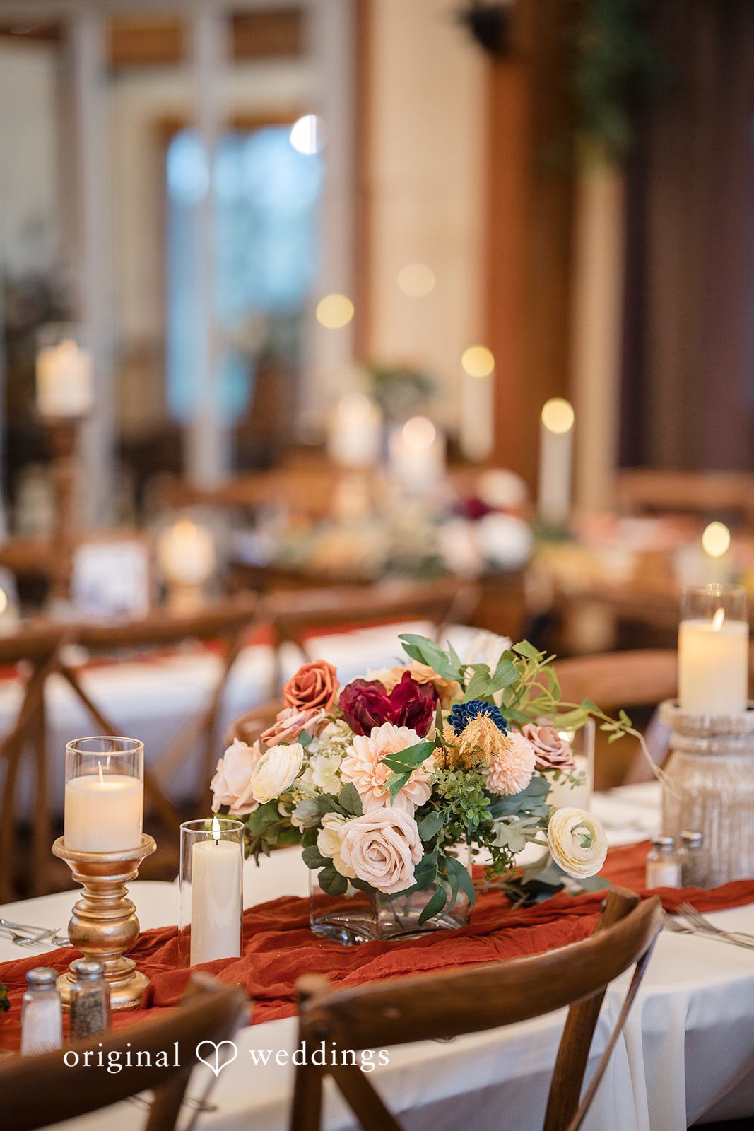 William + Alicia Romantic floral centerpiece arrangement with candles at Barnwood Events