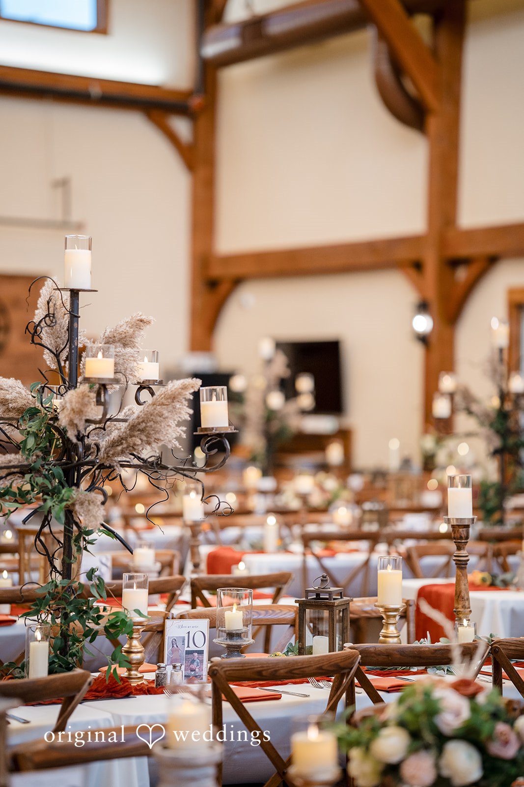 William + Alicia Elegant reception table decor with candles at Barnwood Events