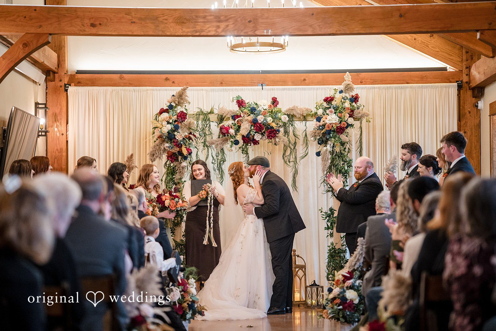 William + Alicia Romantic wedding kiss moment at Barnwood Events