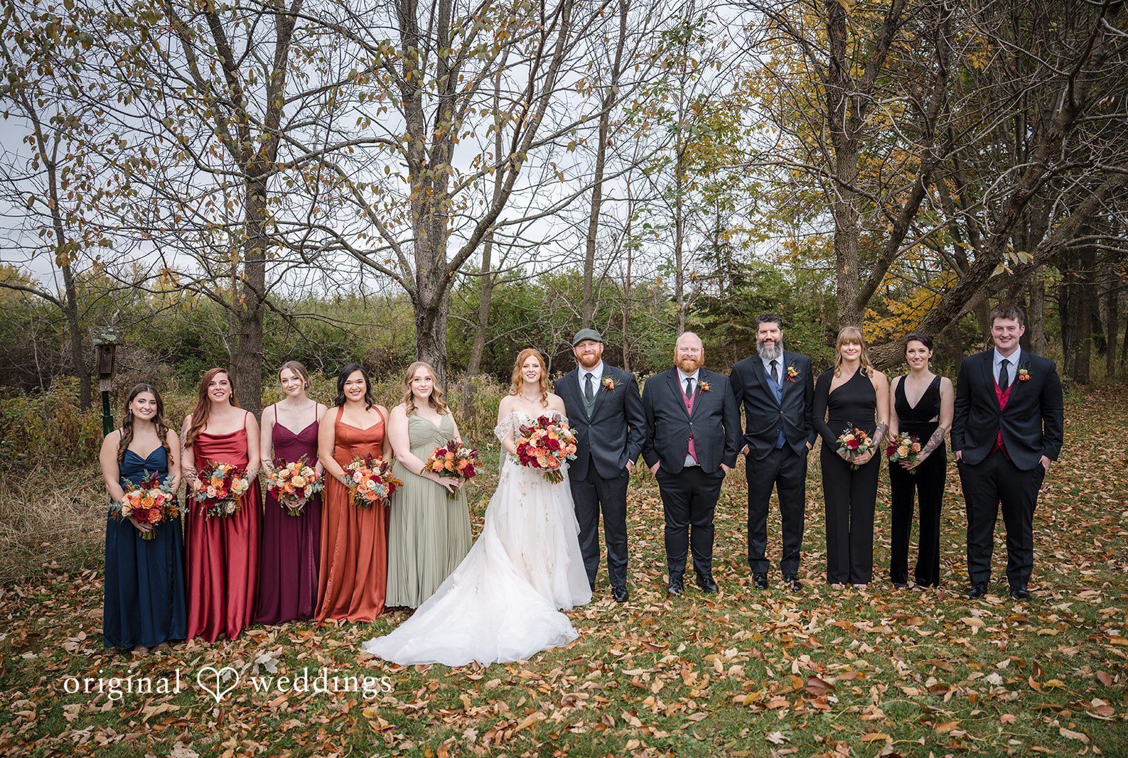 Madison Wedding Photographers capturing couple group photo with bridesmaids and groomsmen at Barnwood Events by Original Weddings