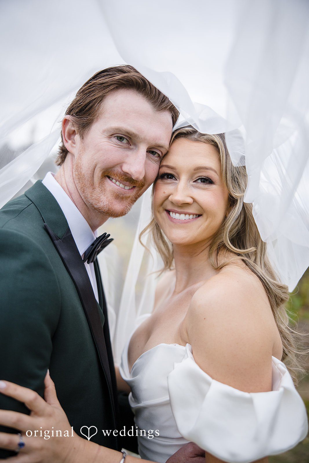 Olivia + Connor Happy candid moment shared between the bride and groom