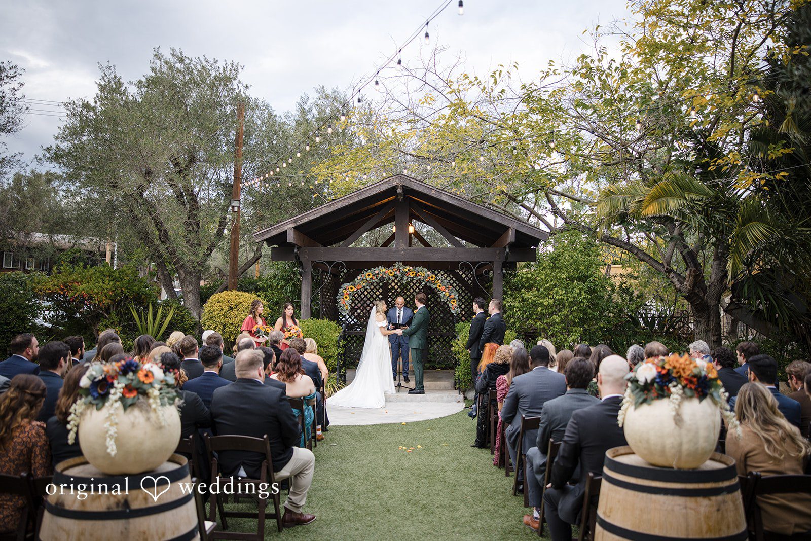 Olivia + Connor Couple posing with guests during the wedding ceremony