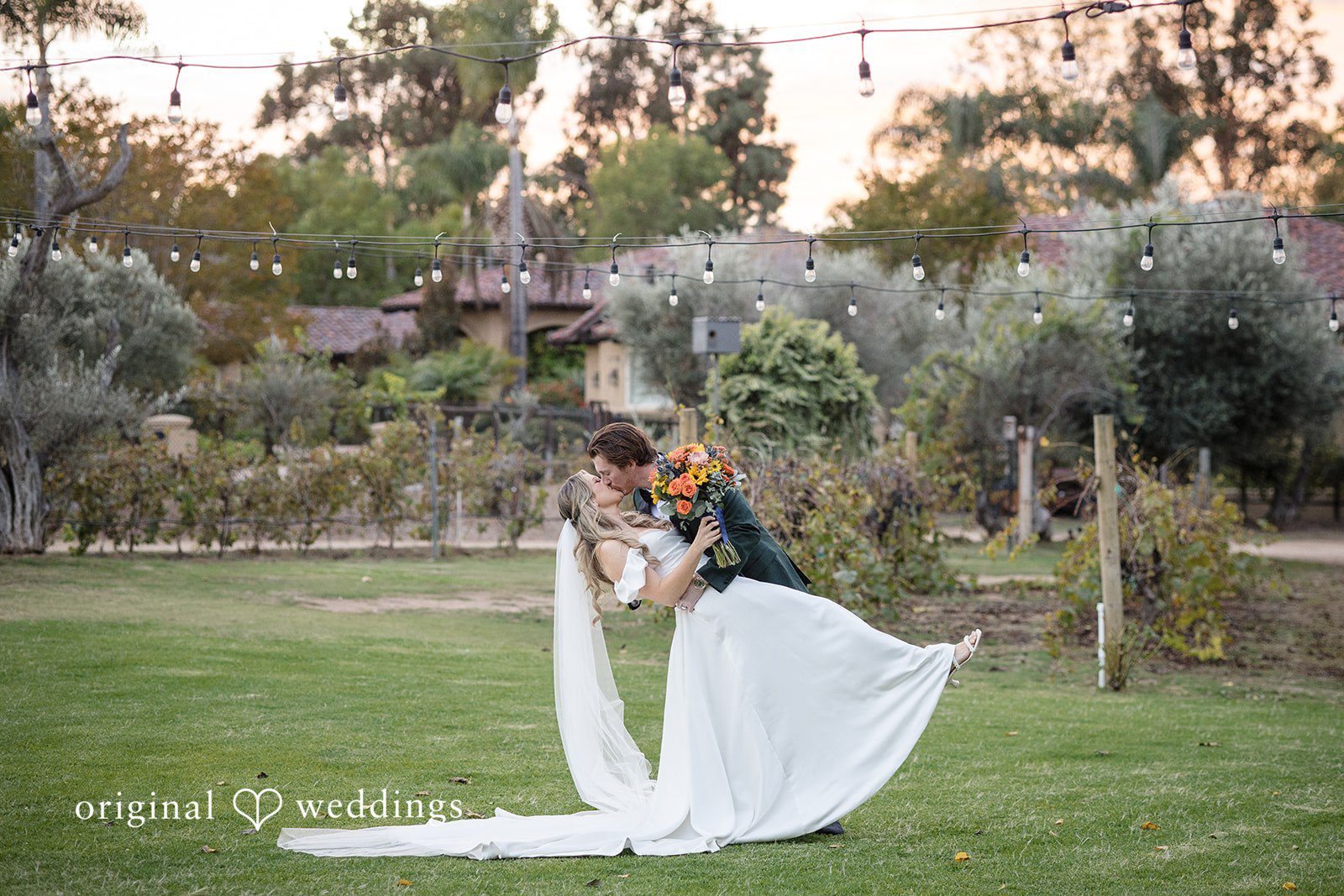 Olivia + Connor Groom embracing the bride during outdoor wedding portraits