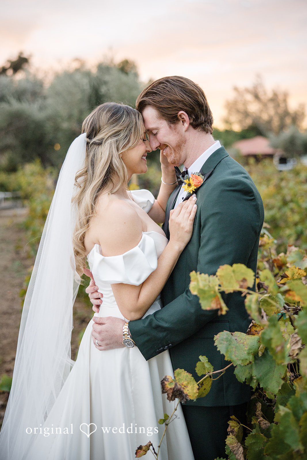 Olivia + Connor Bride and groom looking at each other among the flowers