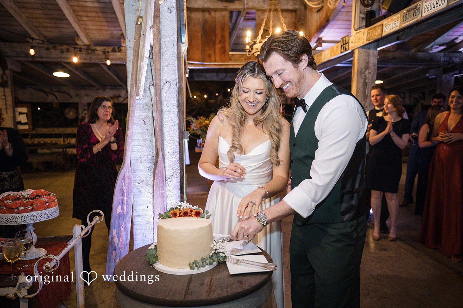 Olivia + Connor Bride and groom cutting their wedding cake together
