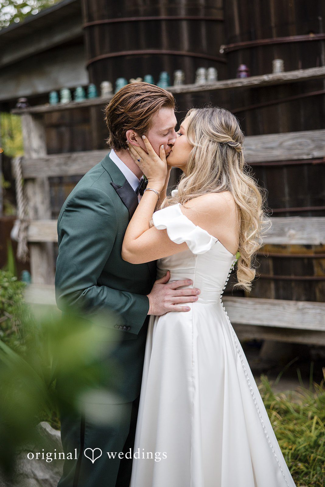 Olivia + Connor Bride and groom sharing a kiss during wedding portraits