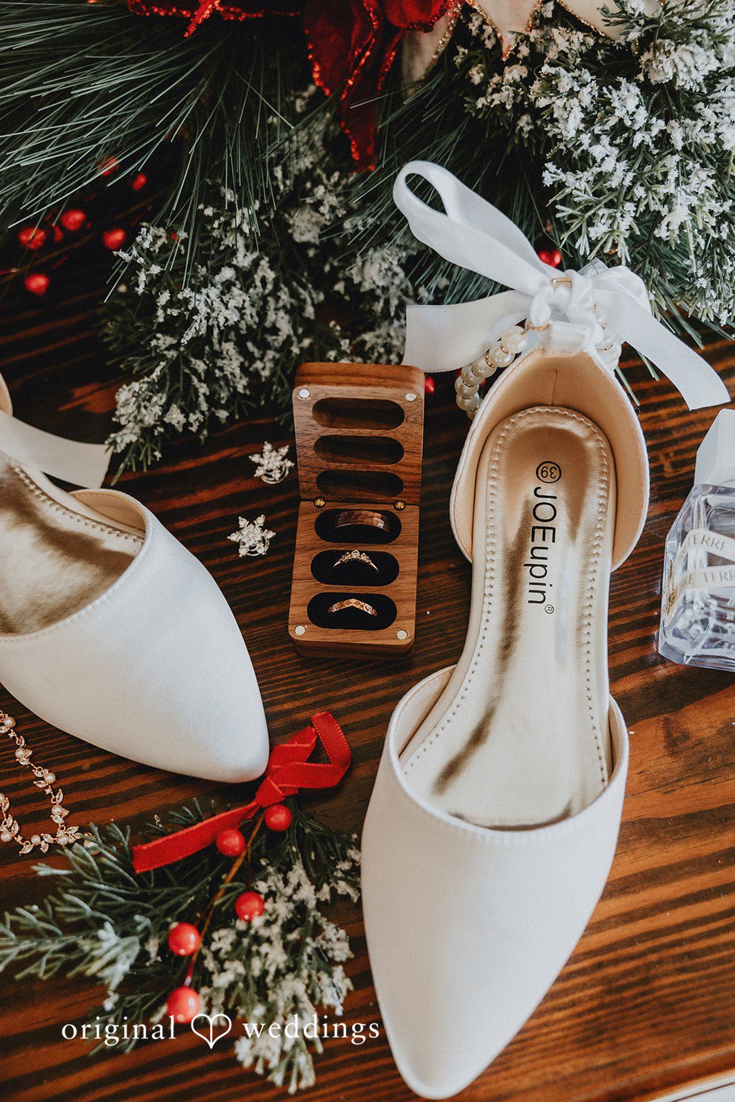 Beautiful wedding detail shot featuring bridal shoes and wedding rings