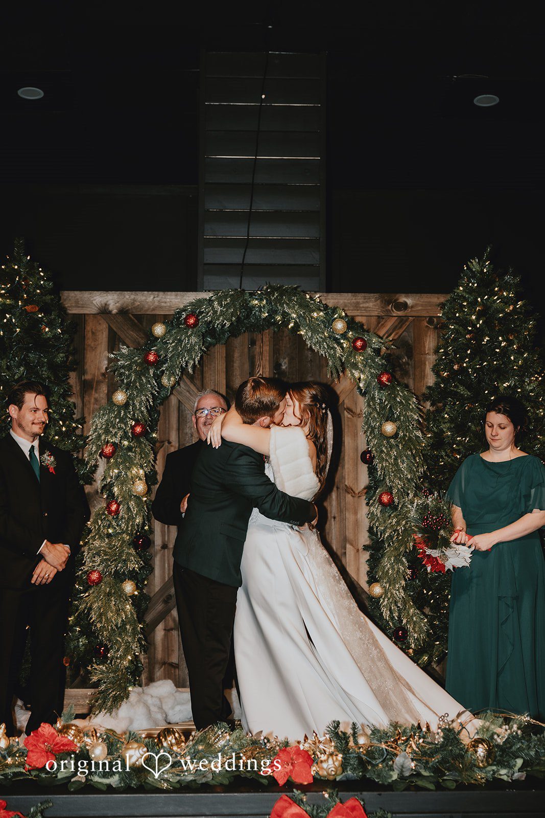 Bride and groom sharing first kiss