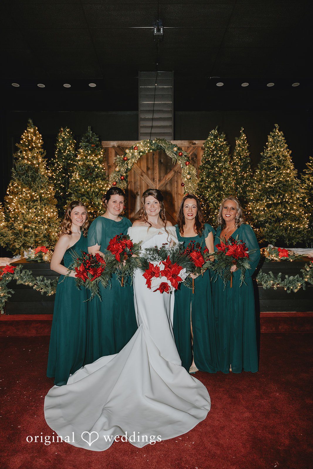 Bride posing with bridesmaids at Bethel Baptist Church