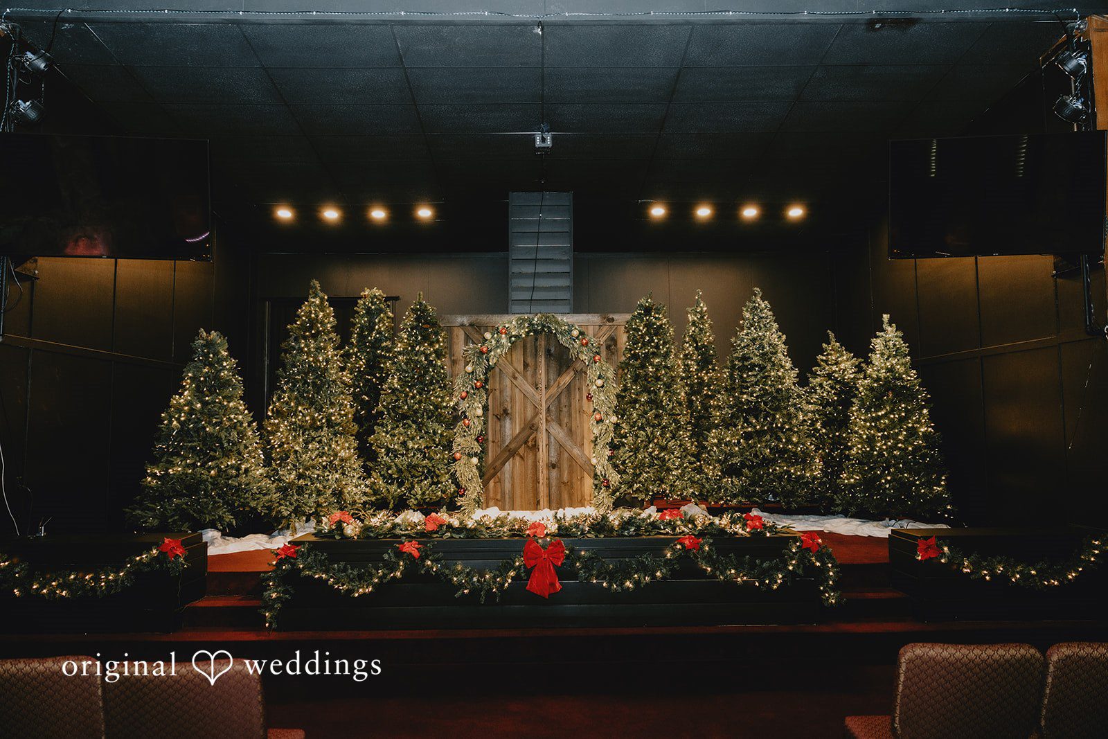 Christmas themed wedding ceremony setup at Bethel Baptist Church captured by Oklahoma City wedding photographers from Original Weddings
