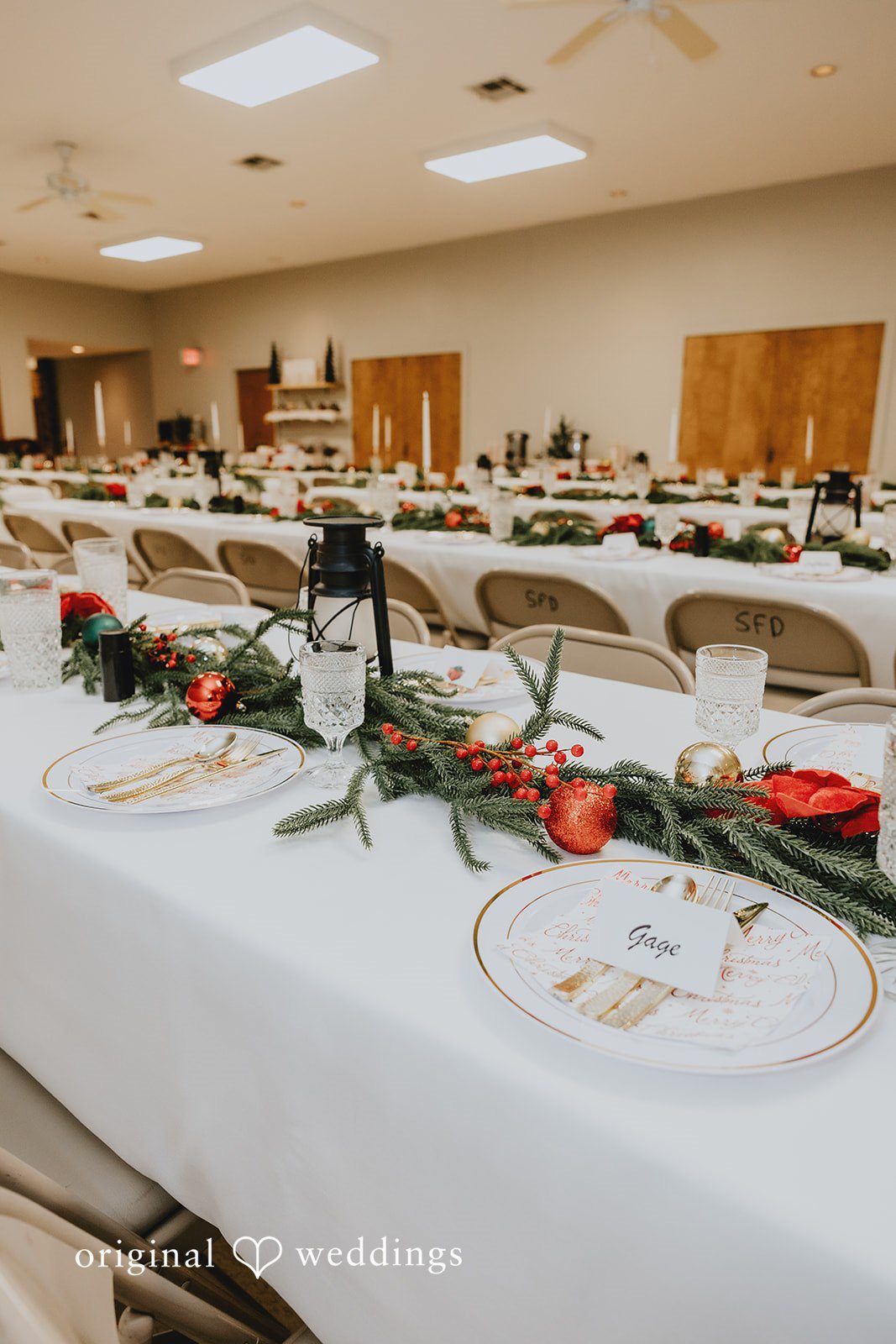 Elegant wedding table centerpiece with greenery and festive ornaments
