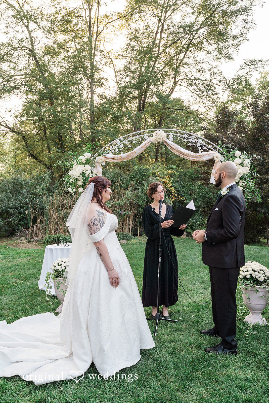 NYC wedding photography at Bird and Bottle Inn capturing emotional wedding ceremony moment of couple standing before priest by Original Weddings
