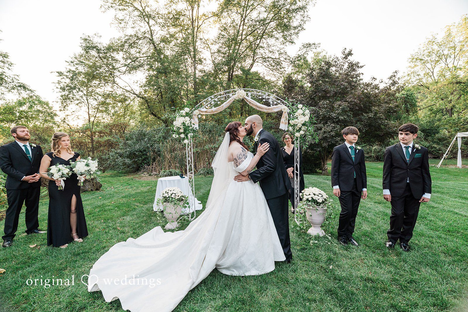 Couple kissing during wedding ceremony at Bird and Bottle Inn