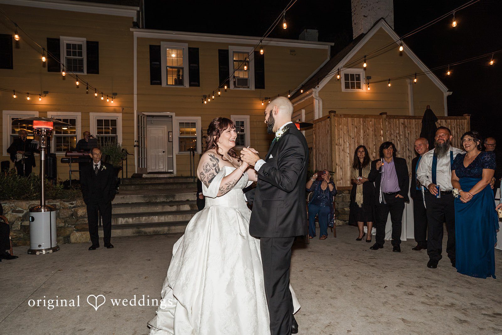 Couple dancing while looking at each other at Bird and Bottle Inn
