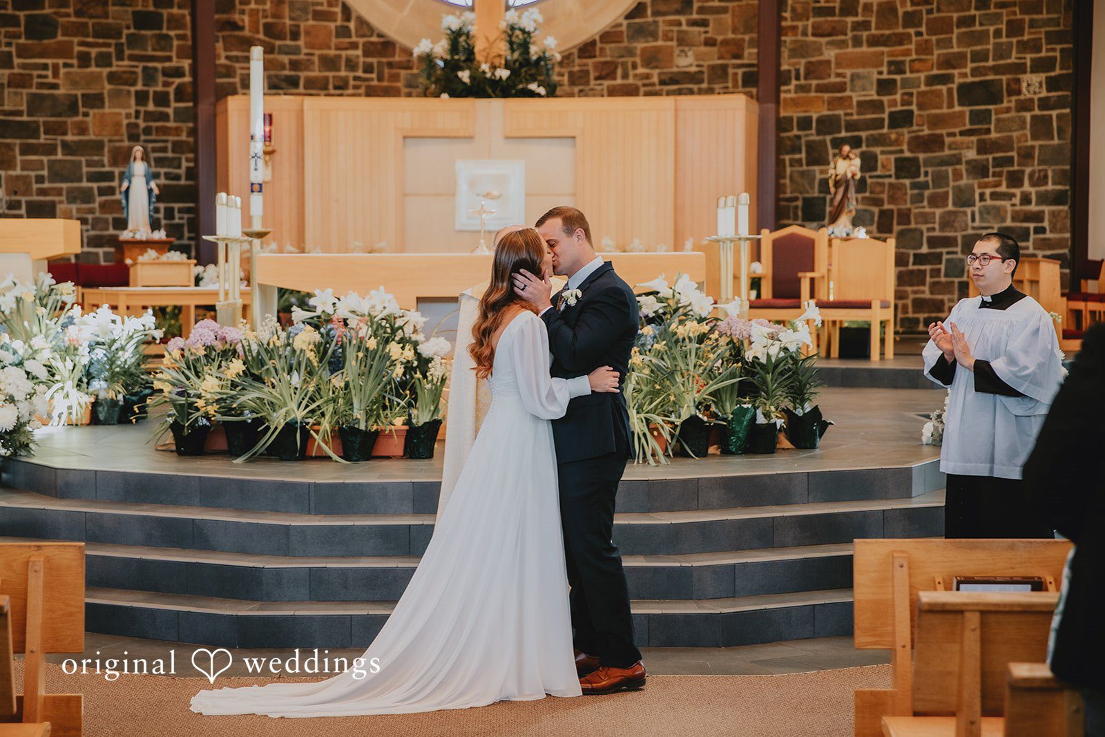 Romantic wedding kiss during the ceremony