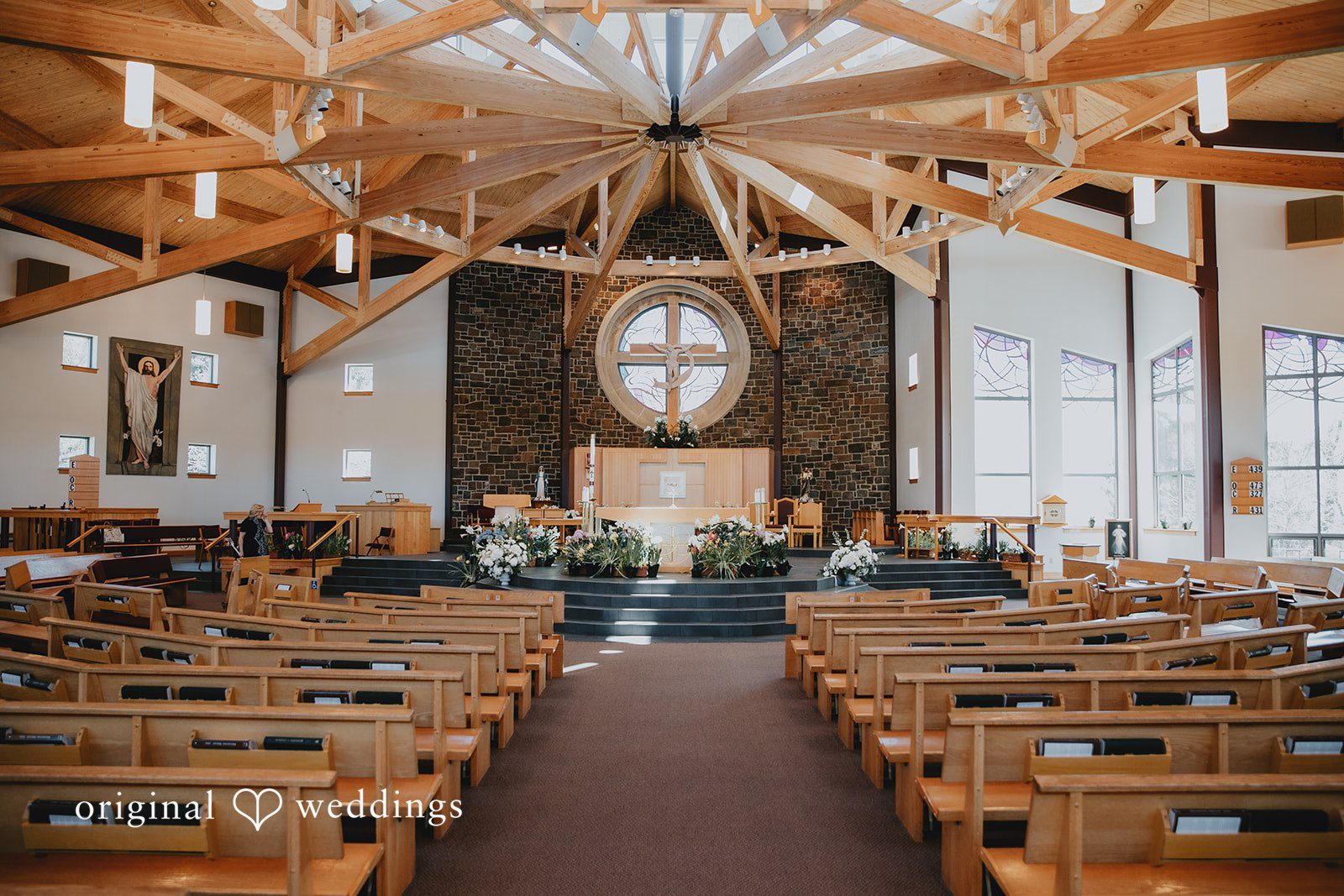 Indoor ceremony space at church with elegant wooden architecture