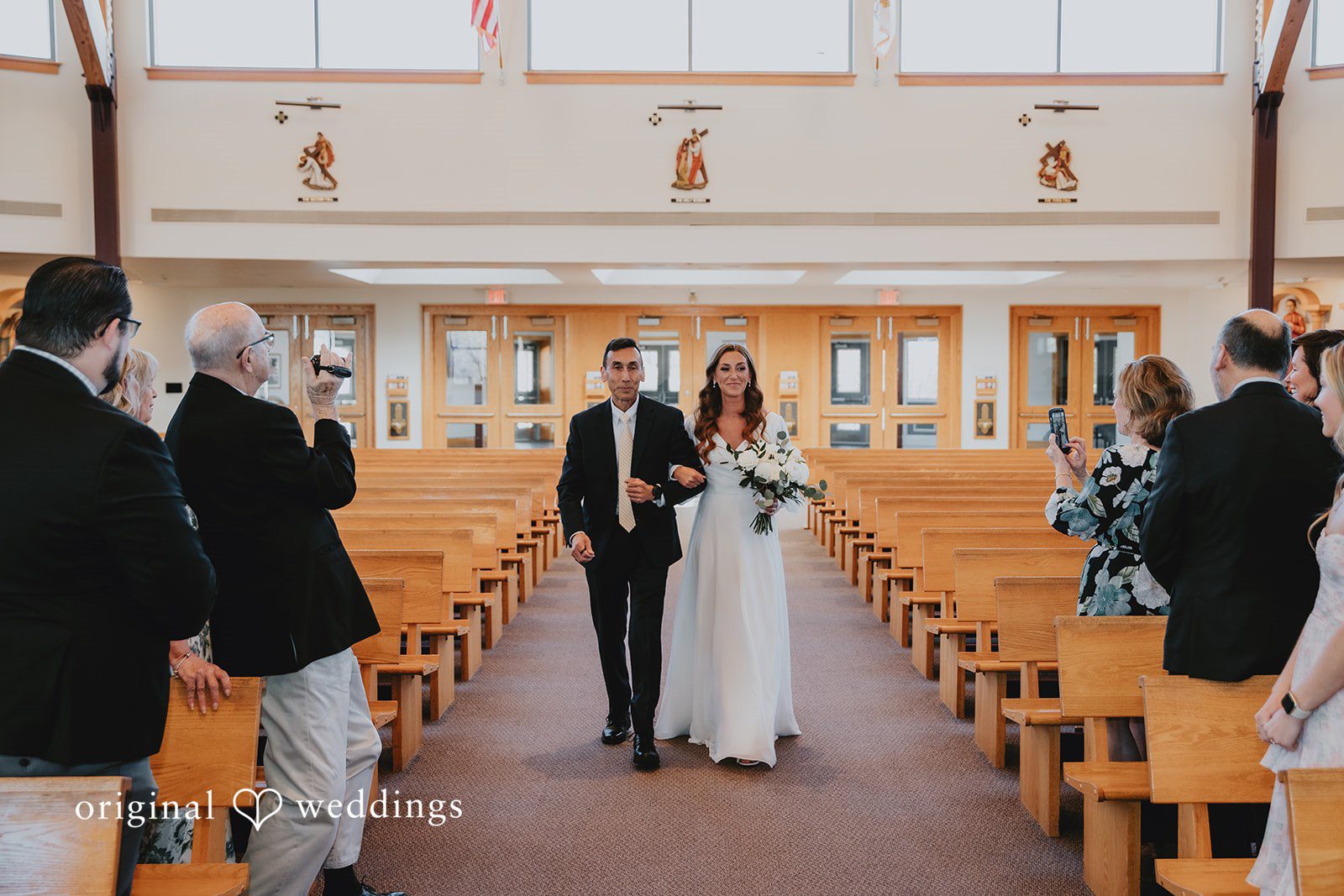 Bride walking down the aisle during the ceremony
