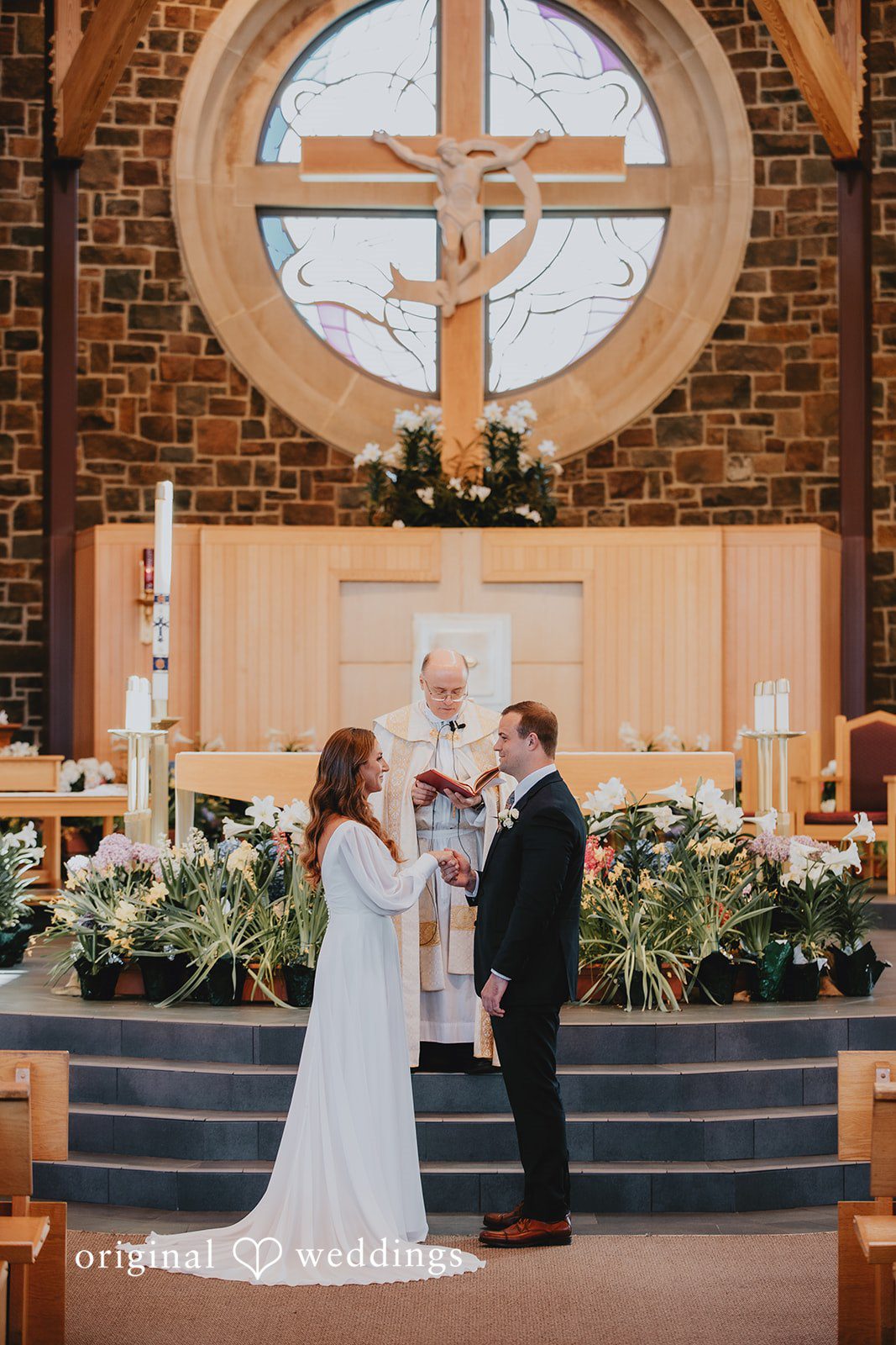 Couple exchanging vows during the indoor ceremony