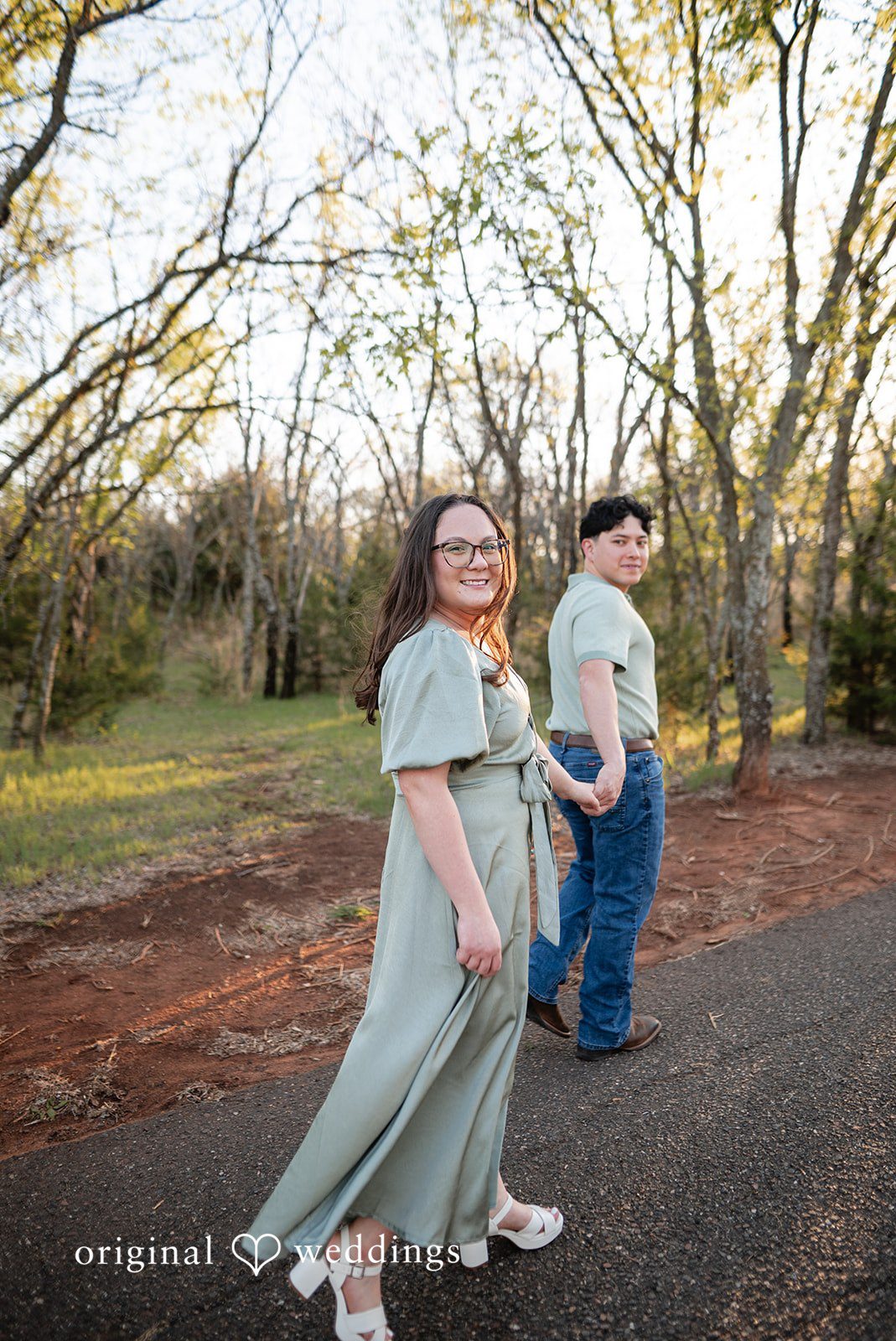 The couple takes a walk through the park