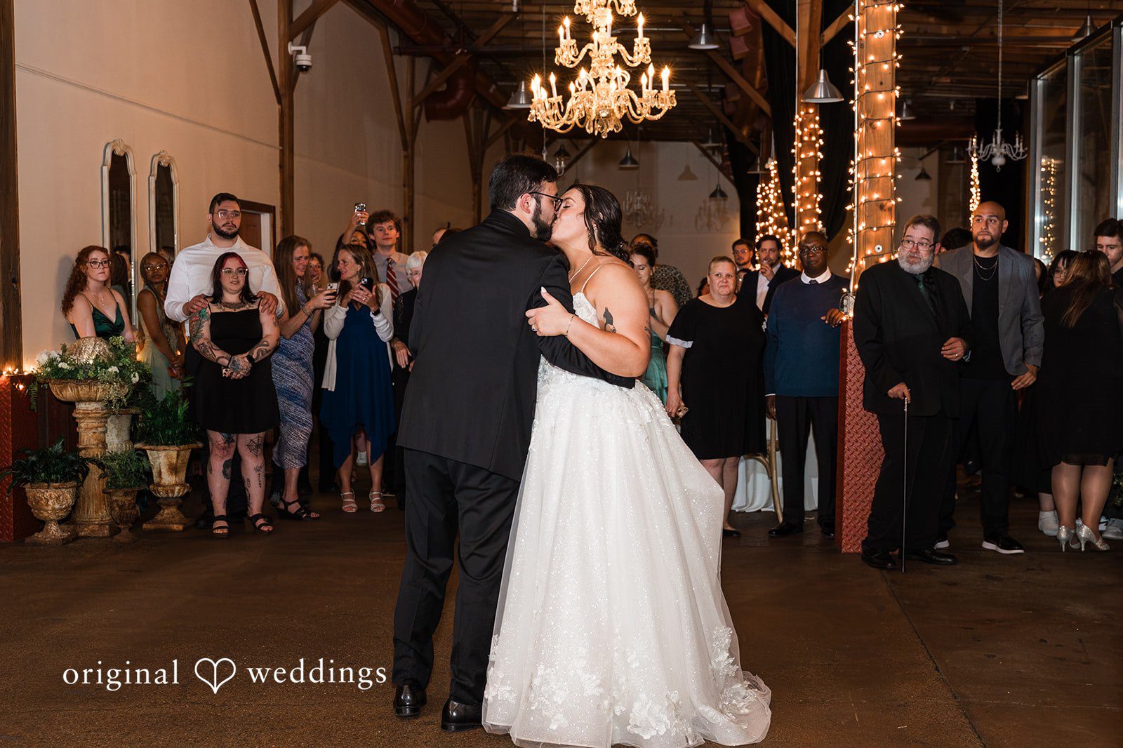 Emotional dance kiss of bride and groom at Blumen Gardens