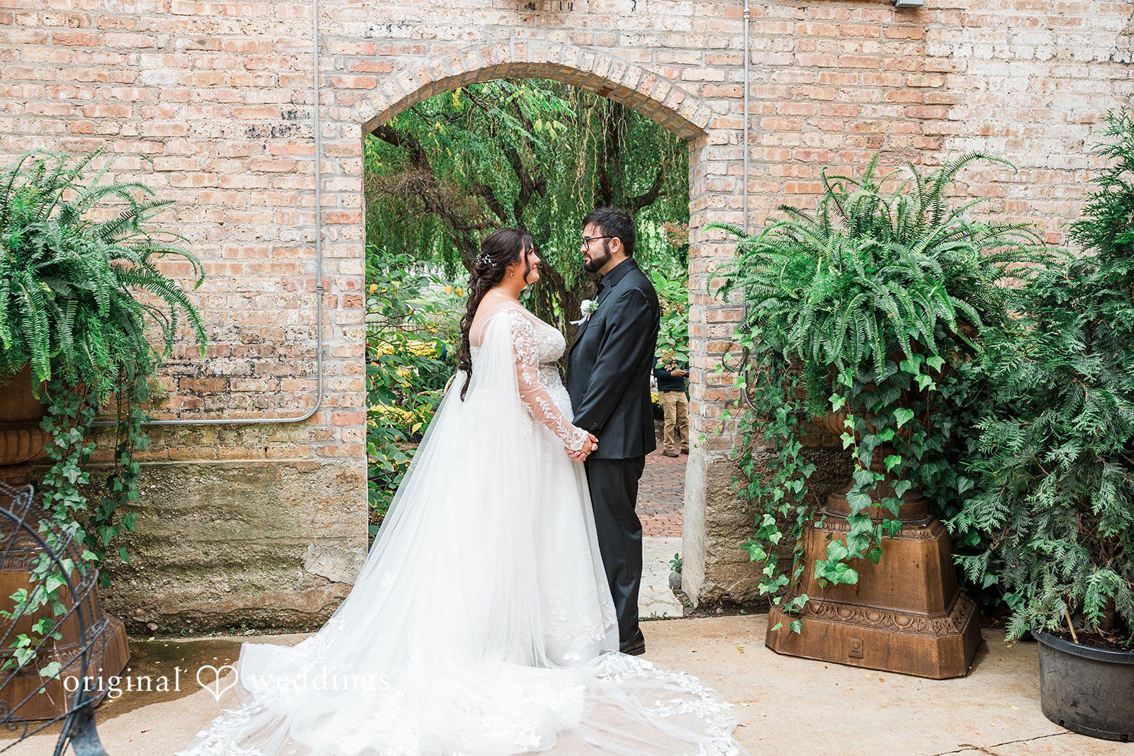 Couple looking at each other at Blumen Gardens
