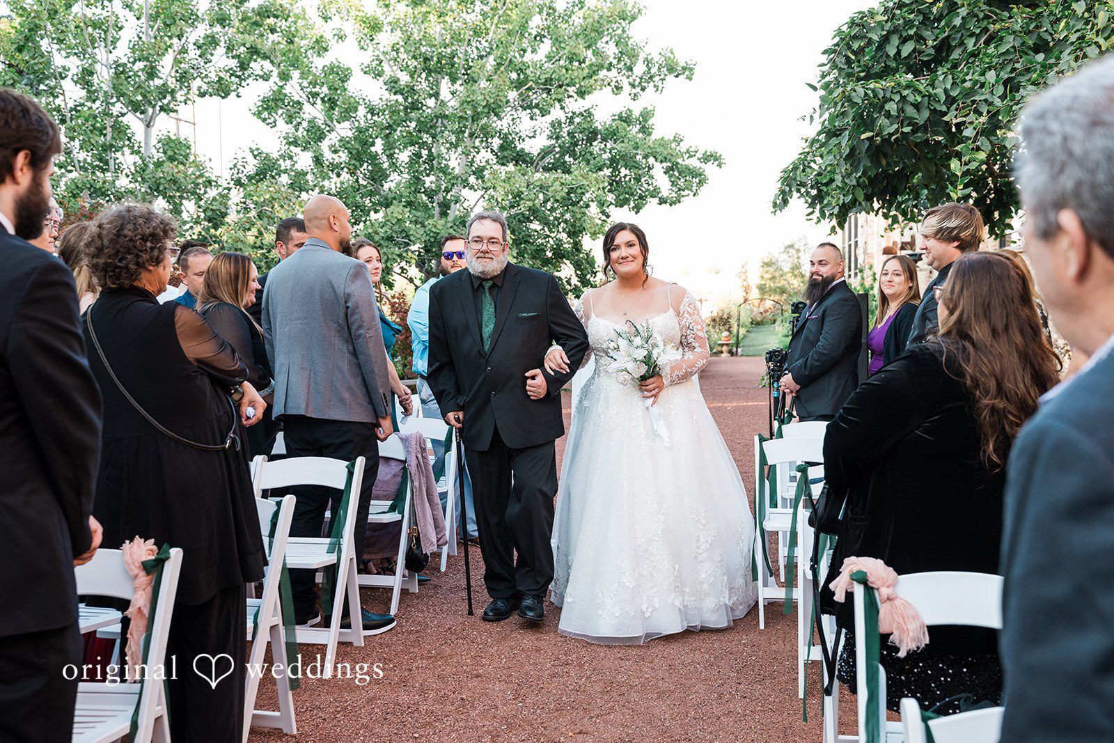 Elegant bridal entrance during ceremony at Blumen Gardens