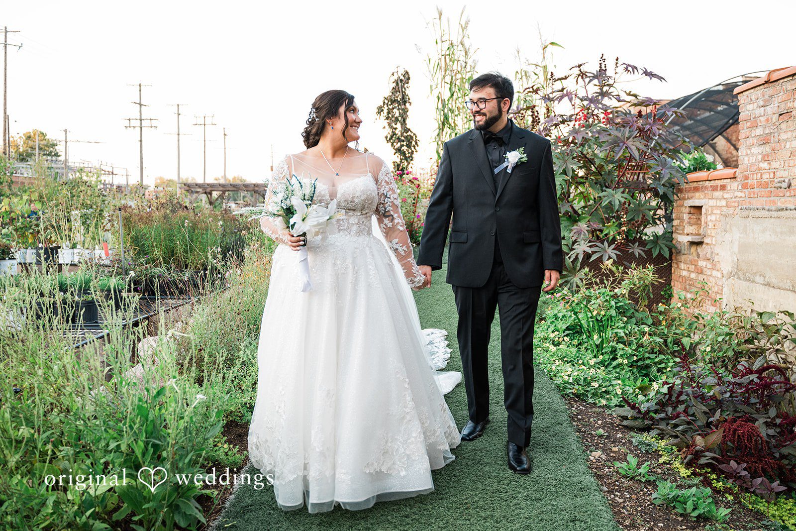 Couple walking while looking at each other at Blumen Gardens