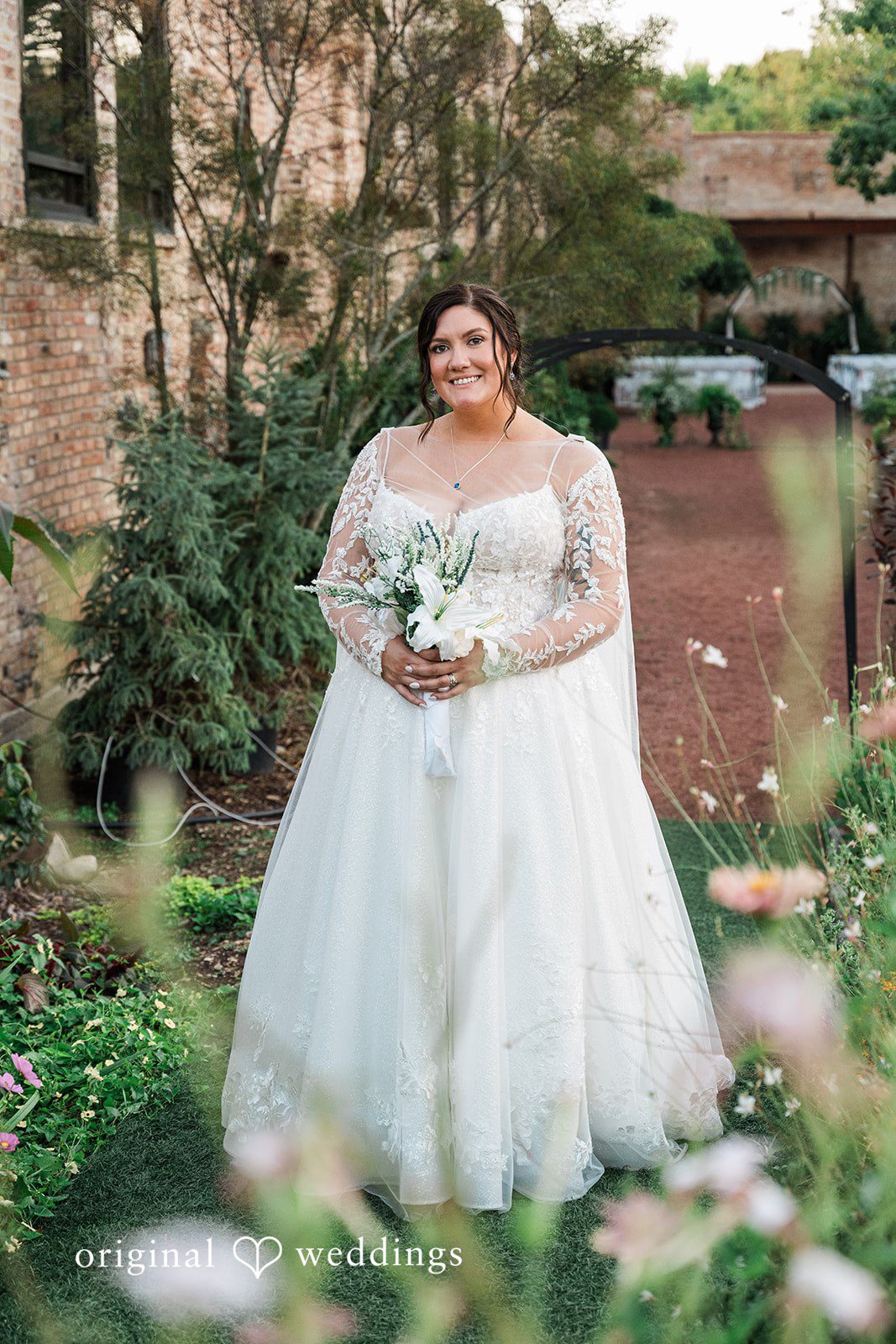 Close-up of bride smiling at Blumen Gardens