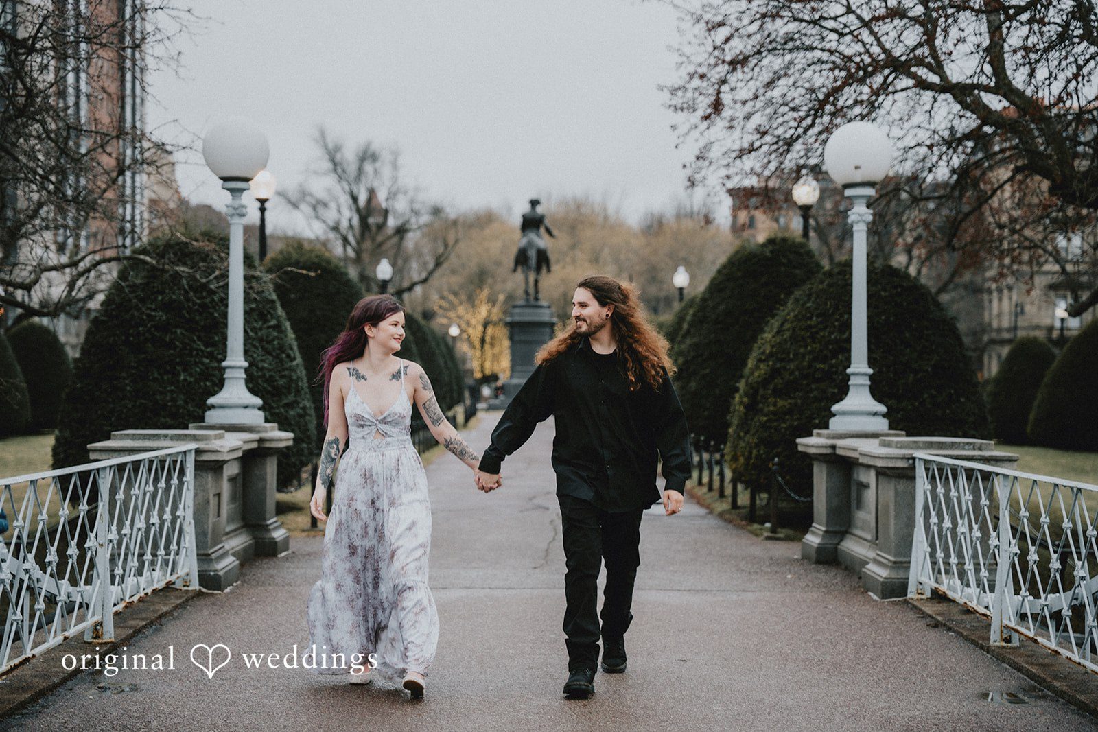 Couple walking hands in hands in Boston Public Garden