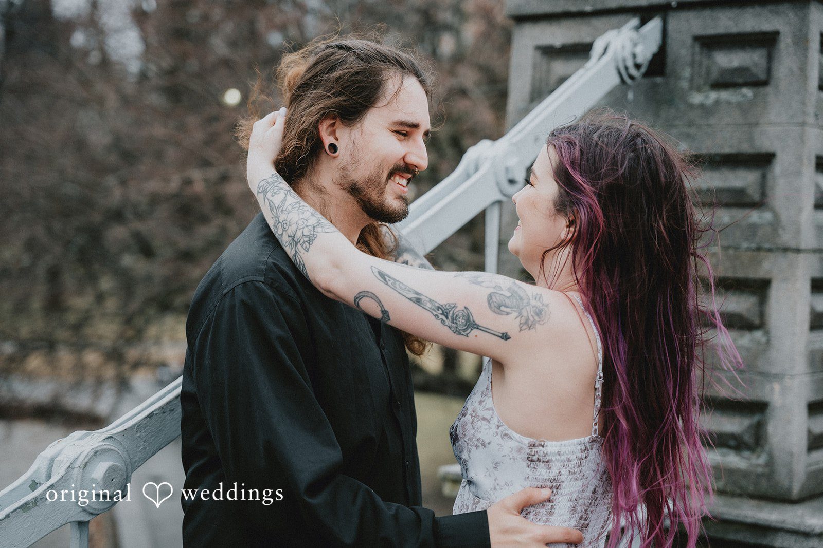 Couple sharing their happiness and looking at each other during photo session