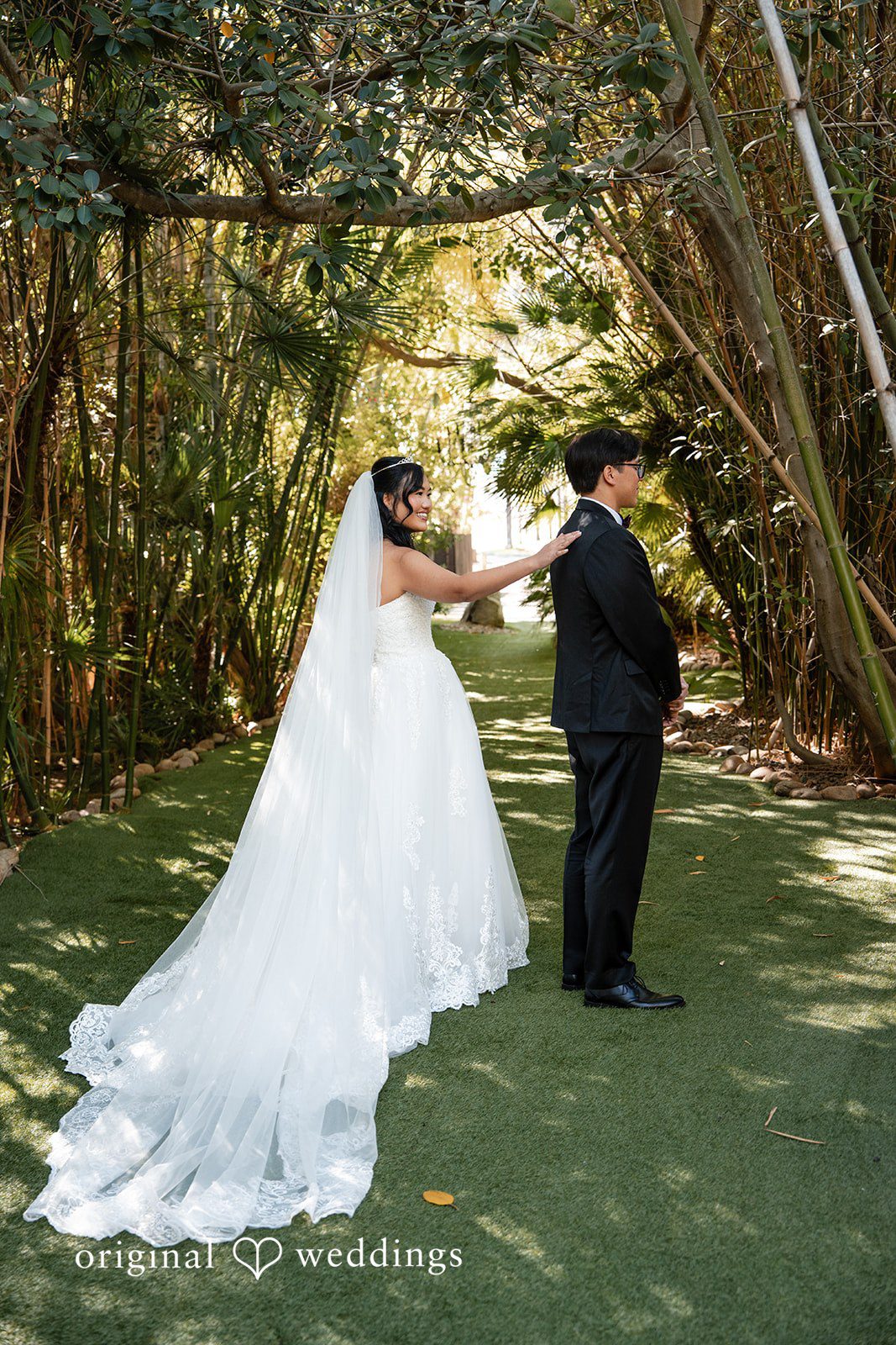 The bride about to unveil herself to the groom