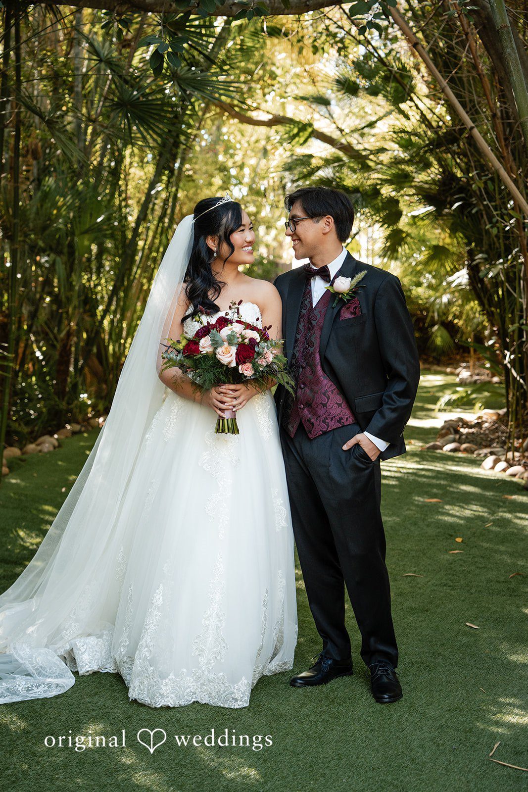 A stunning portrait of the couple through the greenery