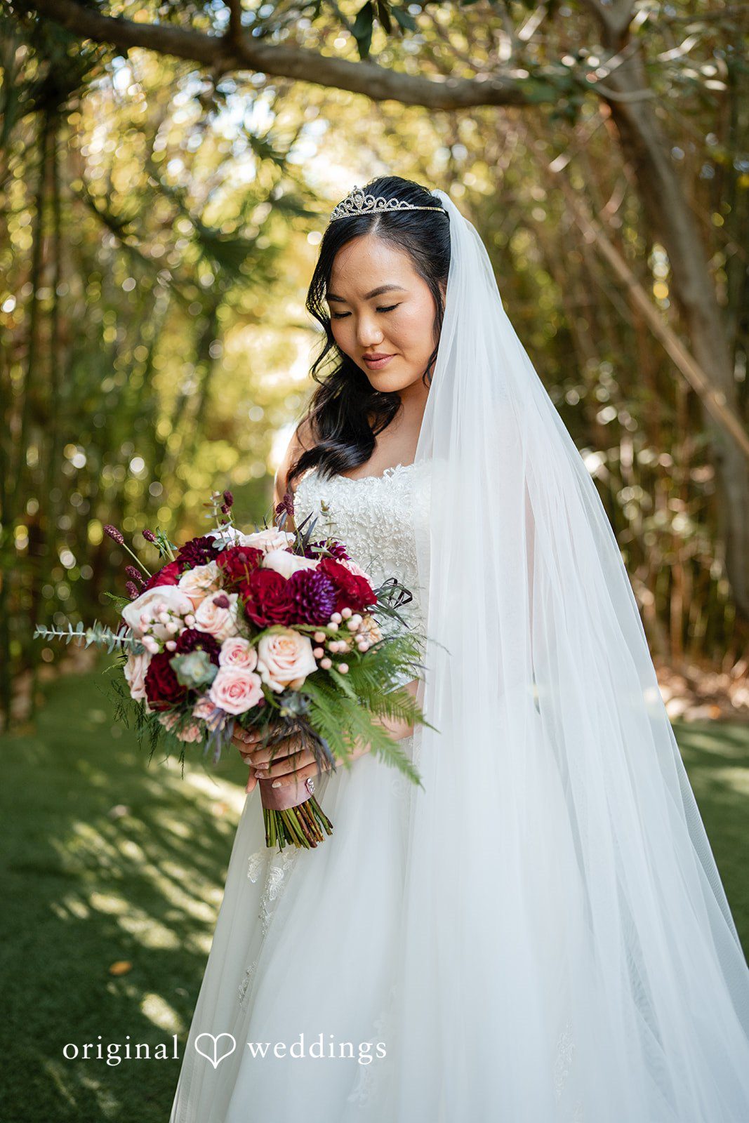 A stunning portrait of the bride holding her bouquet