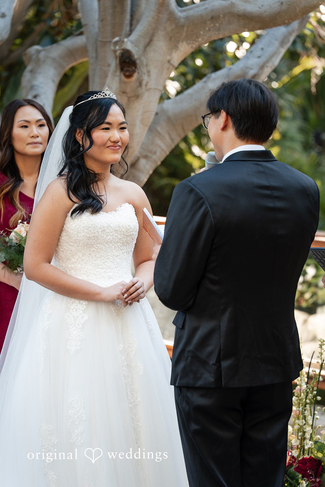 The groom reads his vows to the bride