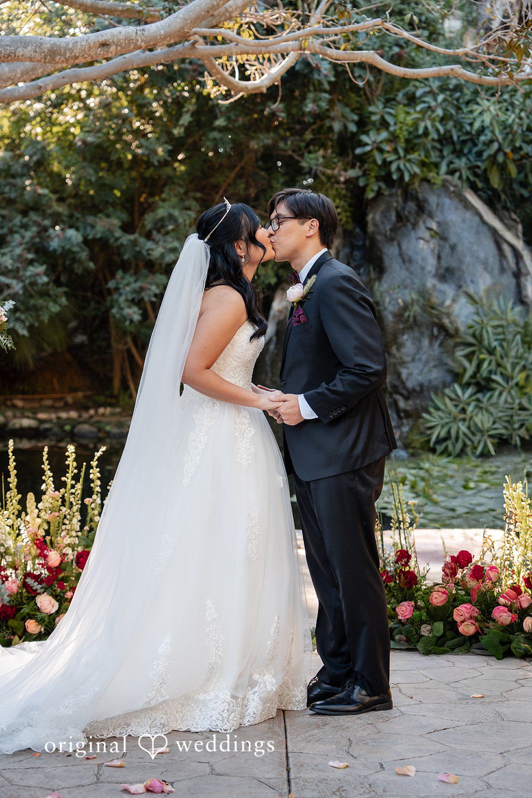 The couple seals their union with a kiss